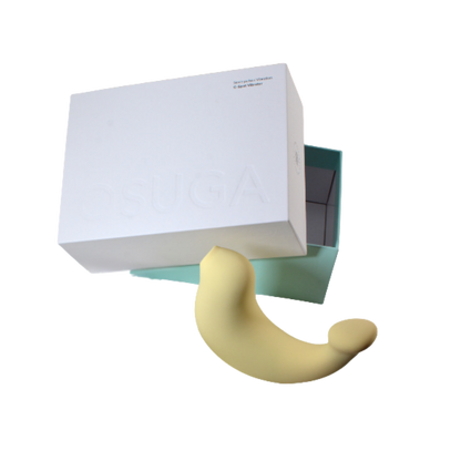 A yellow G-Spa vibrator sitting next to the box.
