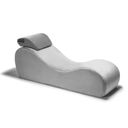 A grey faux leather Lyza Lounger bedroom furniture by Liberator against a white background.