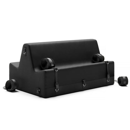 A black Steed Spanking Bench bedroom furniture by Liberator with cuffs against a white background.