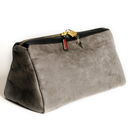 A charcoal Tallulah Locking Toy Bag by Liberator with key and lock against a white background.