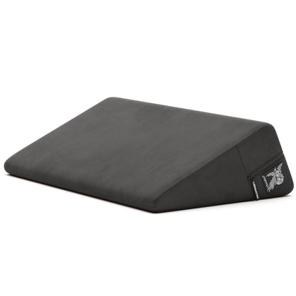 A black Wedge, Bedroom Furniture by Liberator against a white bedroom.